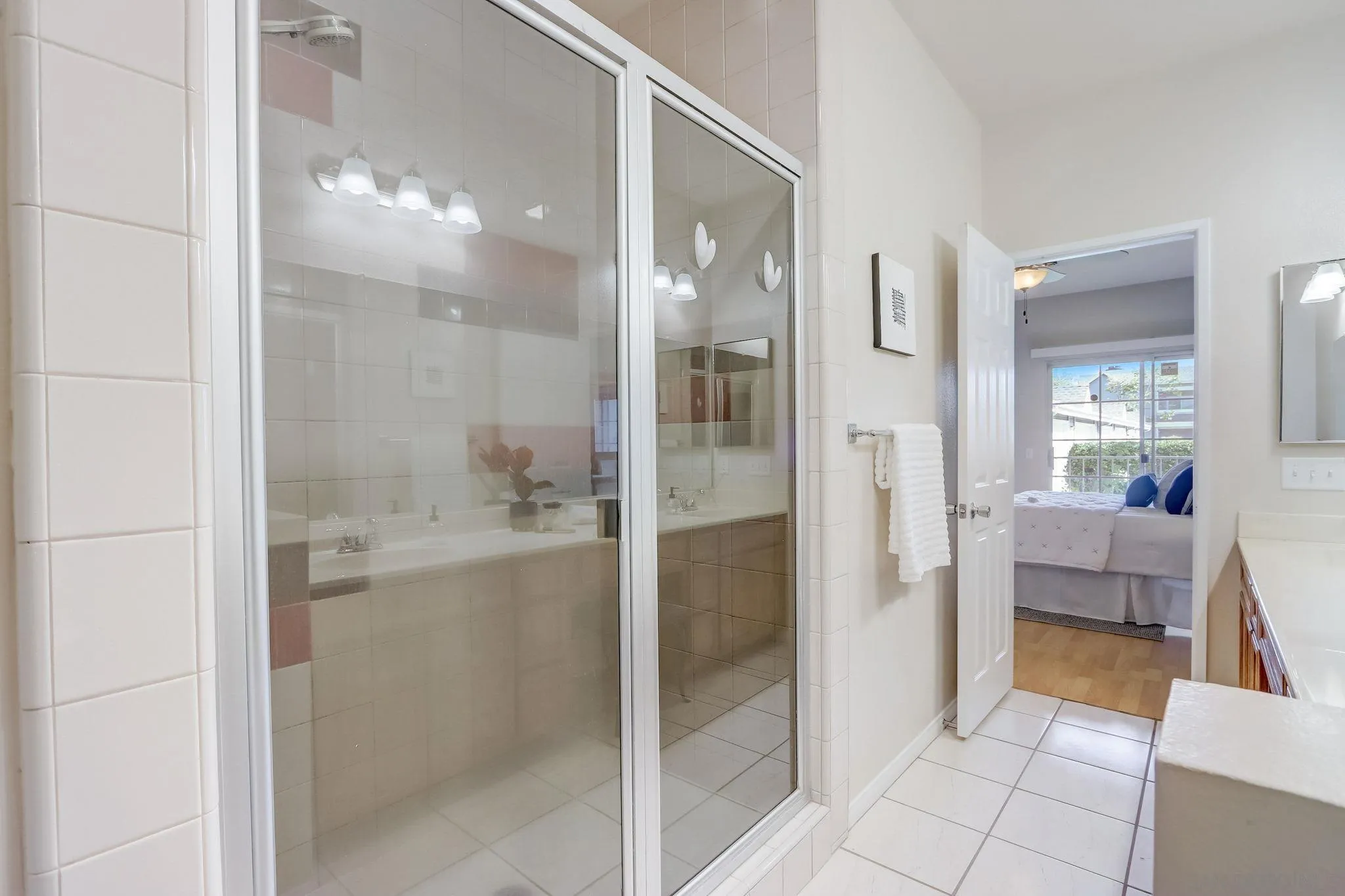 13832 Midland Road Poway, CA 92064 - Photo 21 of 36 a bathroom with a bathtub and a shower