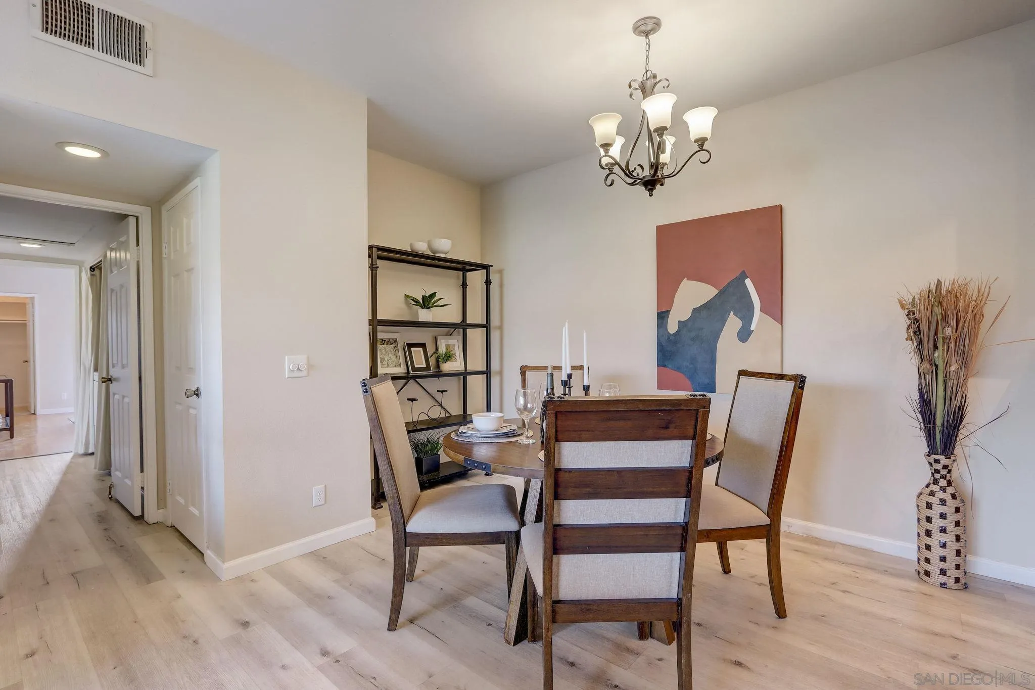 13832 Midland Road Poway, CA 92064 - Photo 8 of 36 a view of a dining room with furniture and wooden floor