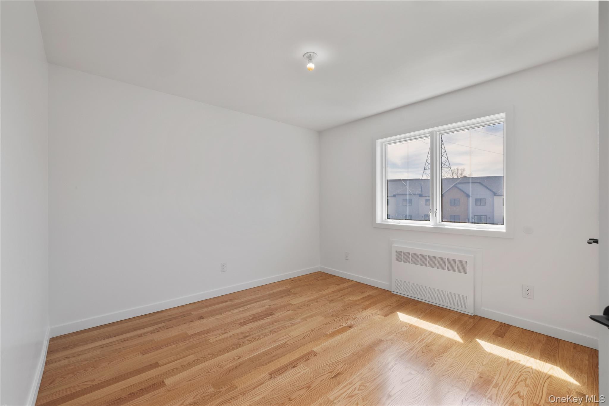 236 Old Nyack Turnpike, Unit 201 Spring Valley, NY 10977 - Photo 33 of 49 an empty room with a window