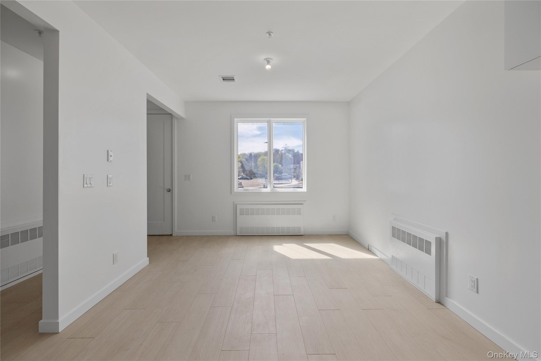 236 Old Nyack Turnpike, Unit 201 Spring Valley, NY 10977 - Photo 43 of 49 a view of an empty room with a window