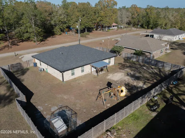an aerial view of a house having yard