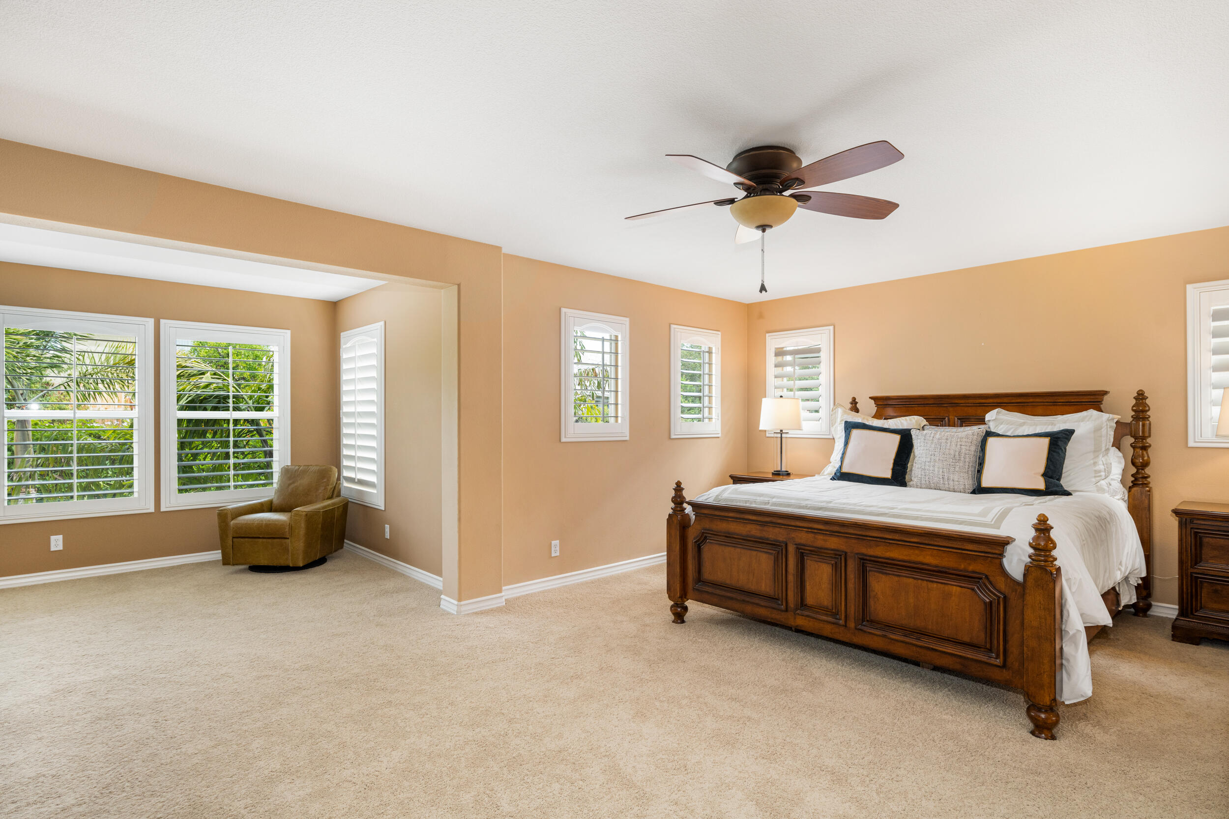 729 Salveson Road Brea, CA 92821 - Photo 14 of 43 a spacious bedroom with a bed and a chandelier