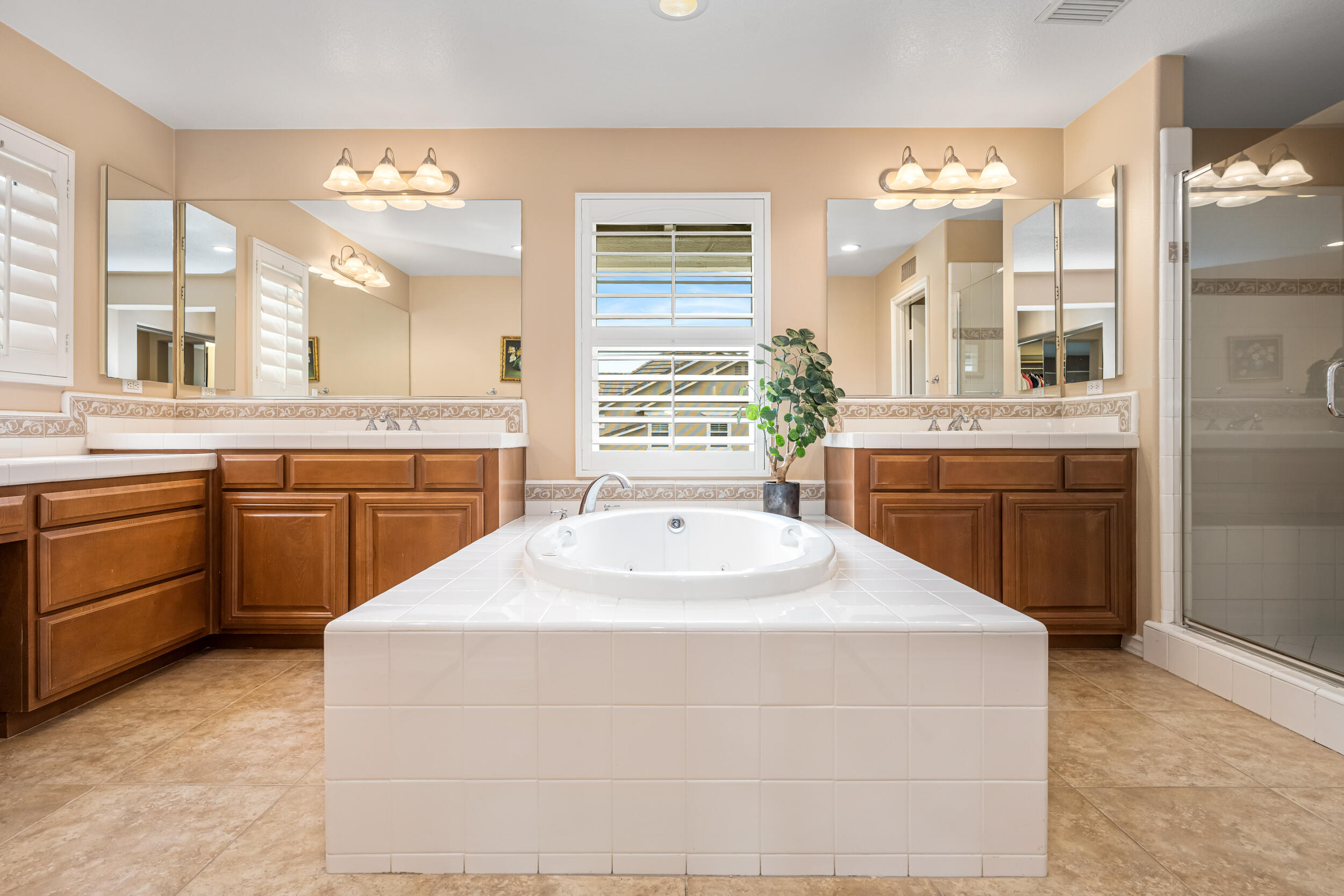 729 Salveson Road Brea, CA 92821 - Photo 16 of 43 a spacious bathroom with a sink a large mirror and a bathtub
