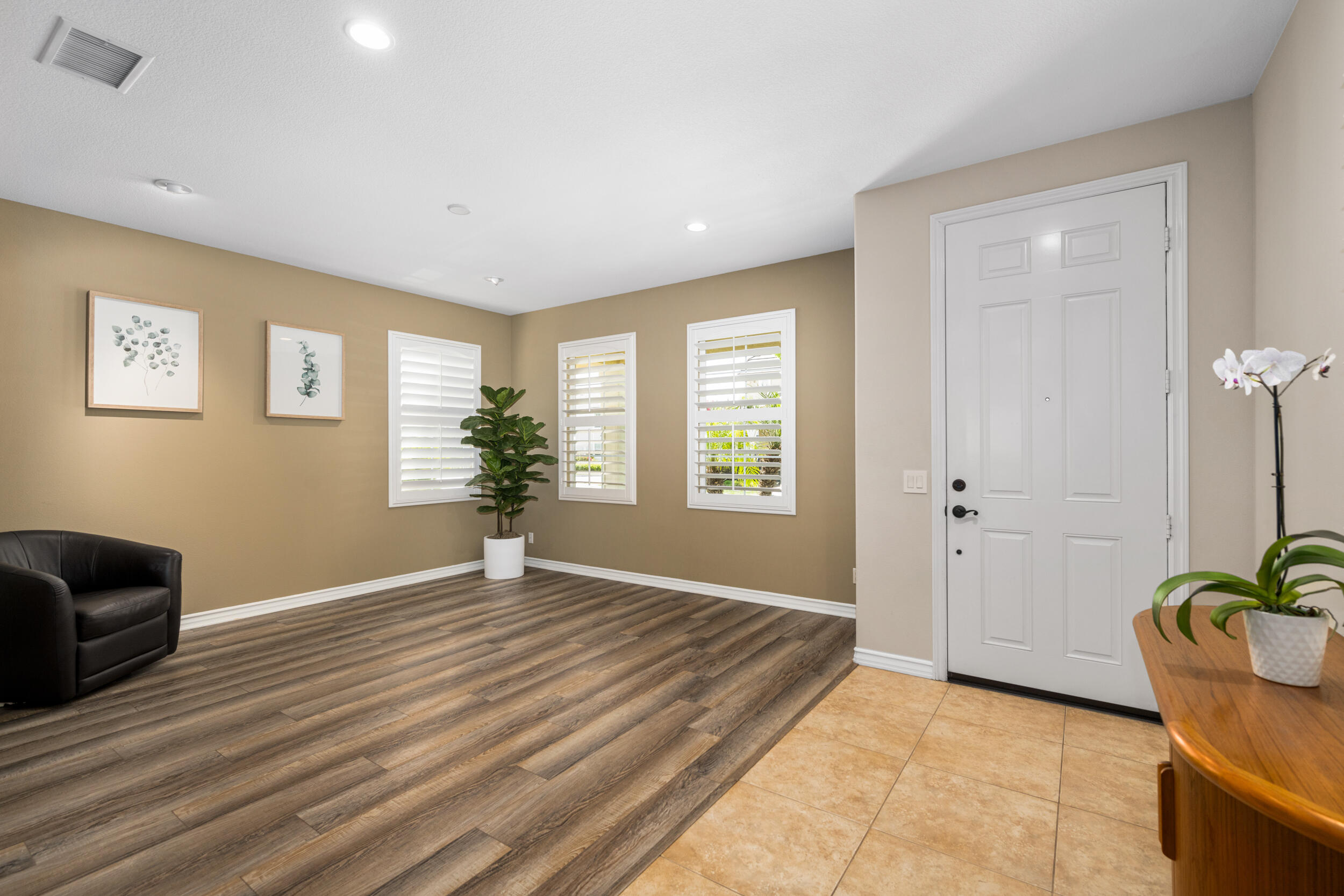 729 Salveson Road Brea, CA 92821 - Photo 18 of 43 a view of an empty room with a window and wooden floor