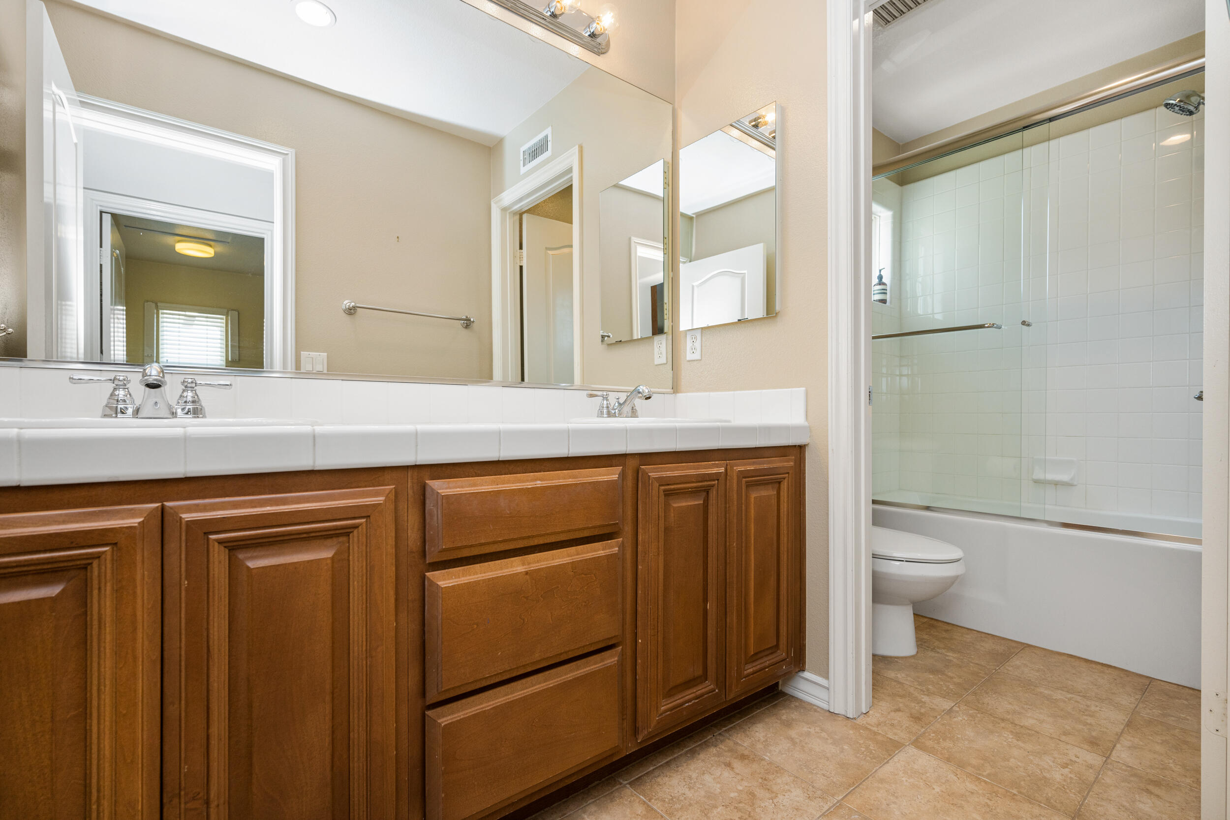 729 Salveson Road Brea, CA 92821 - Photo 26 of 43 a bathroom with a granite countertop sink toilet and shower