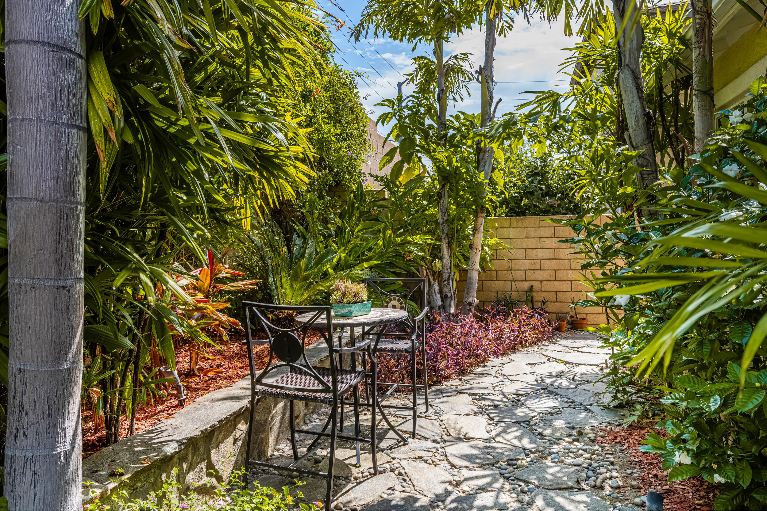 729 Salveson Road Brea, CA 92821 - Photo 32 of 43 a patio with table and chairs and potted plants