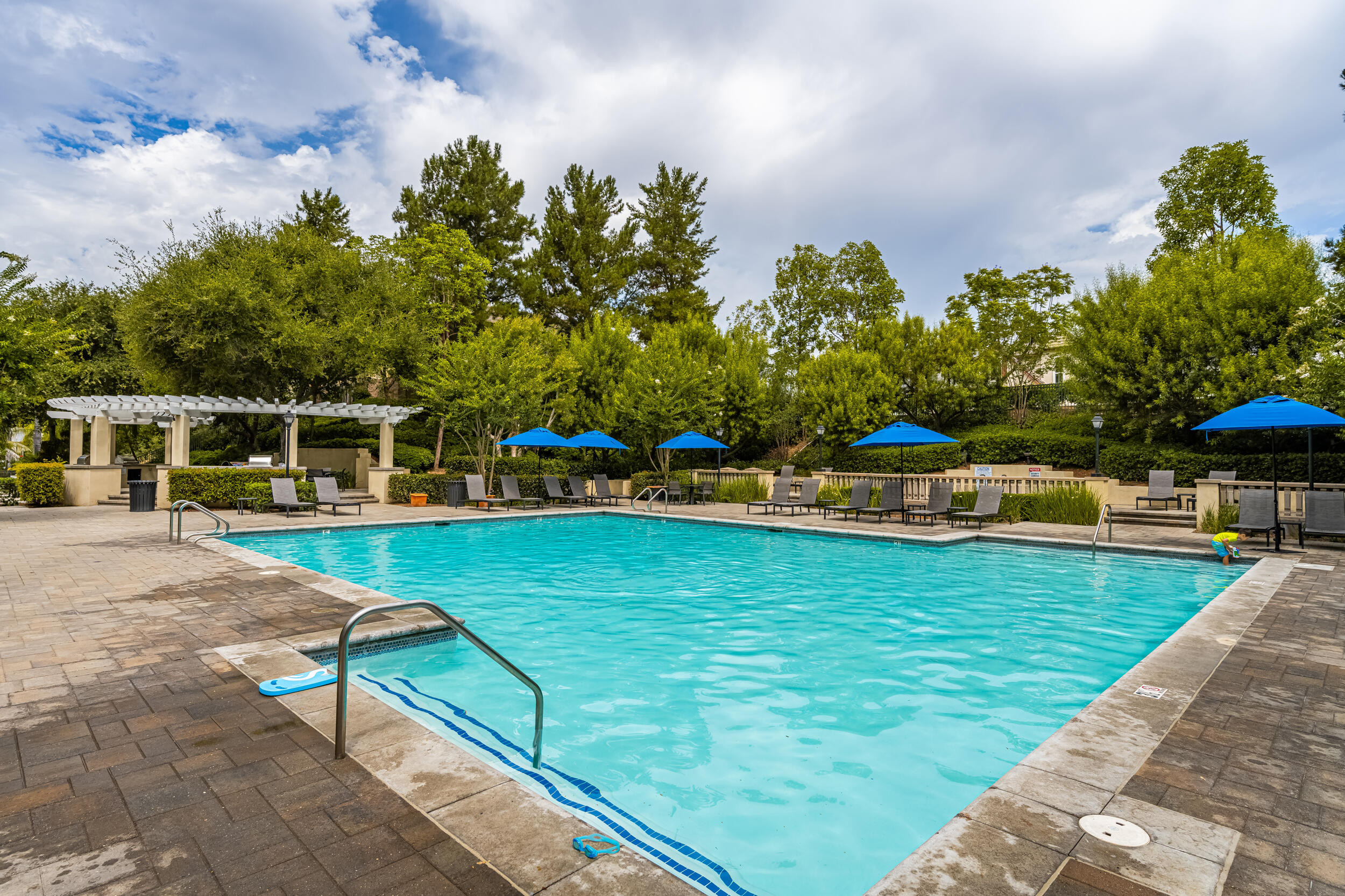 729 Salveson Road Brea, CA 92821 - Photo 37 of 43 a view of a swimming pool with an outdoor space and seating area