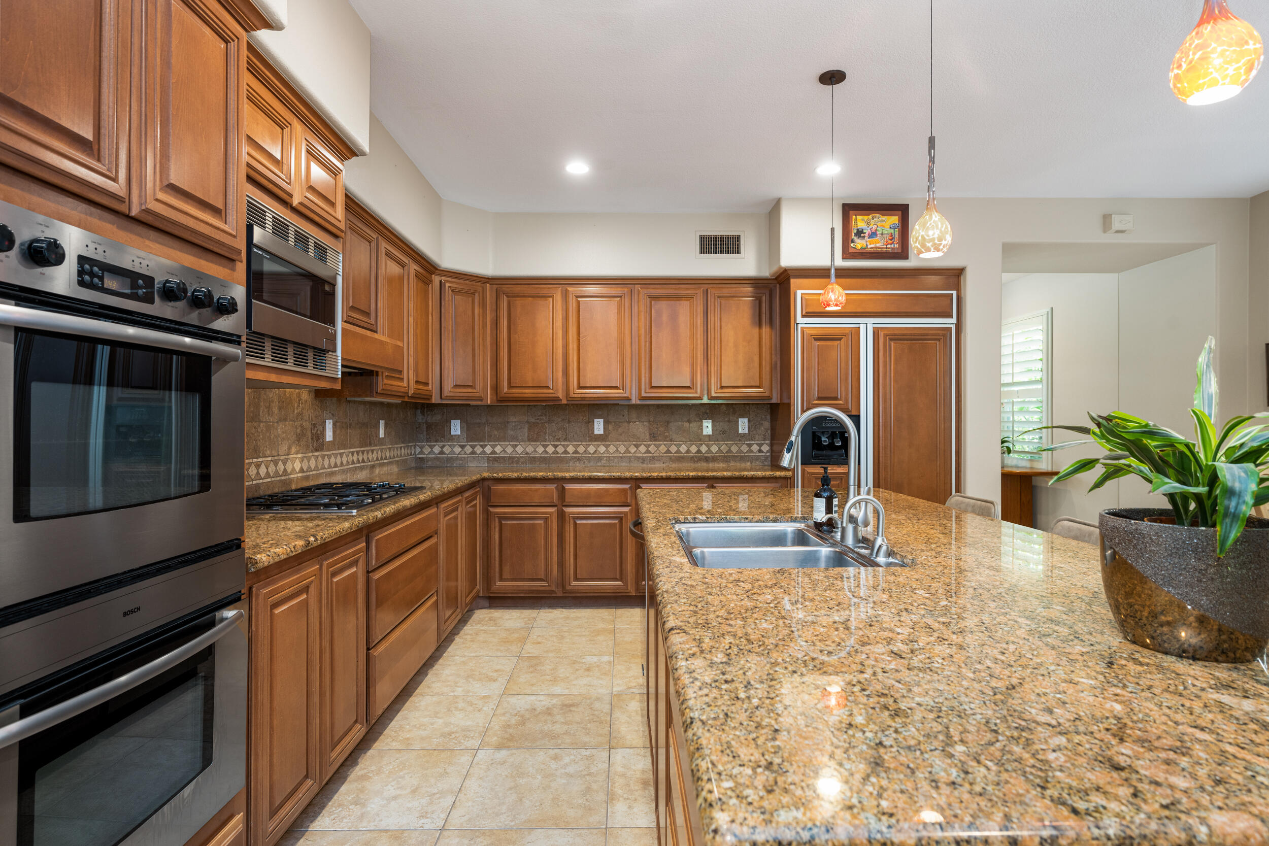 729 Salveson Road Brea, CA 92821 - Photo 8 of 43 a kitchen with stainless steel appliances granite countertop a stove sink and cabinets