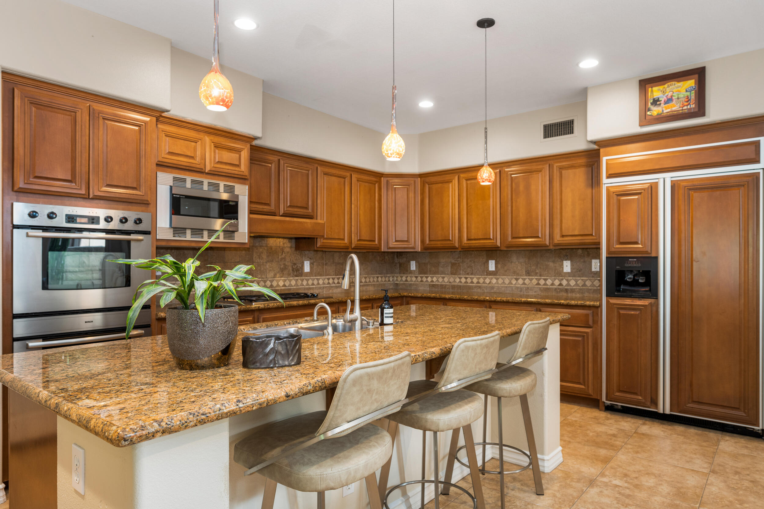 729 Salveson Road Brea, CA 92821 - Photo 9 of 43 a kitchen with a refrigerator a stove a sink cabinets and a dining table