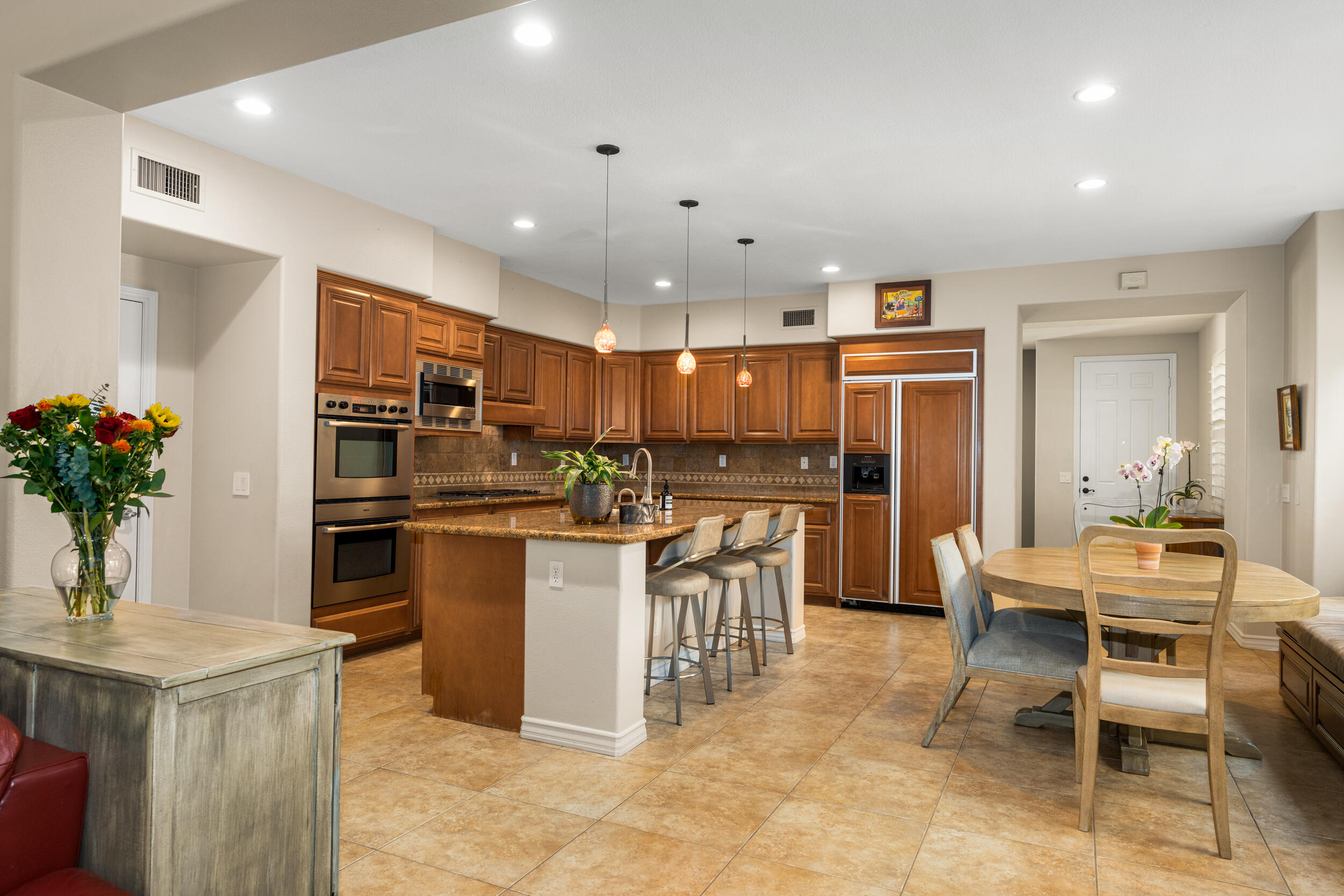 729 Salveson Road Brea, CA 92821 - Photo 10 of 43 a kitchen with cabinets and chairs