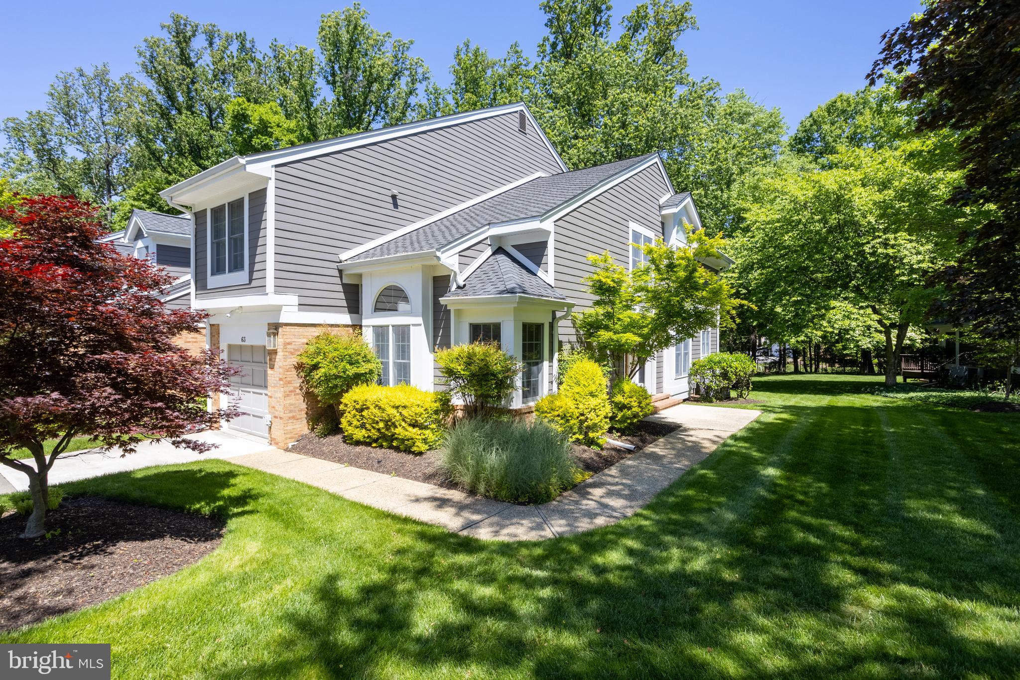 63 Raisin Tree Circle Baltimore, MD 21208 - Photo 2 of 57 a front view of house with a garden and patio