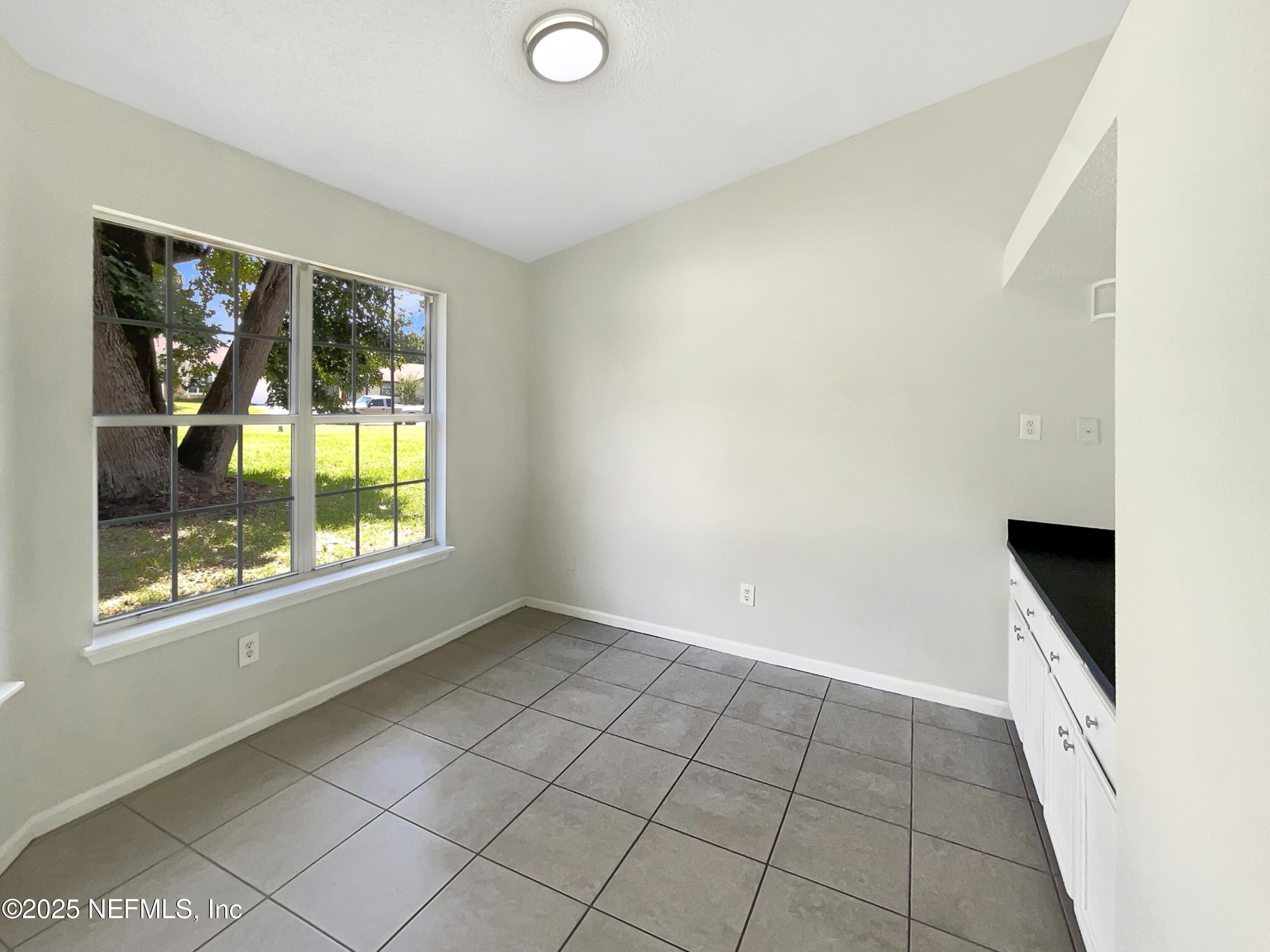 2058 Manucy Court Middleburg, FL 32068 - Photo 7 of 18 a view of an empty room and window