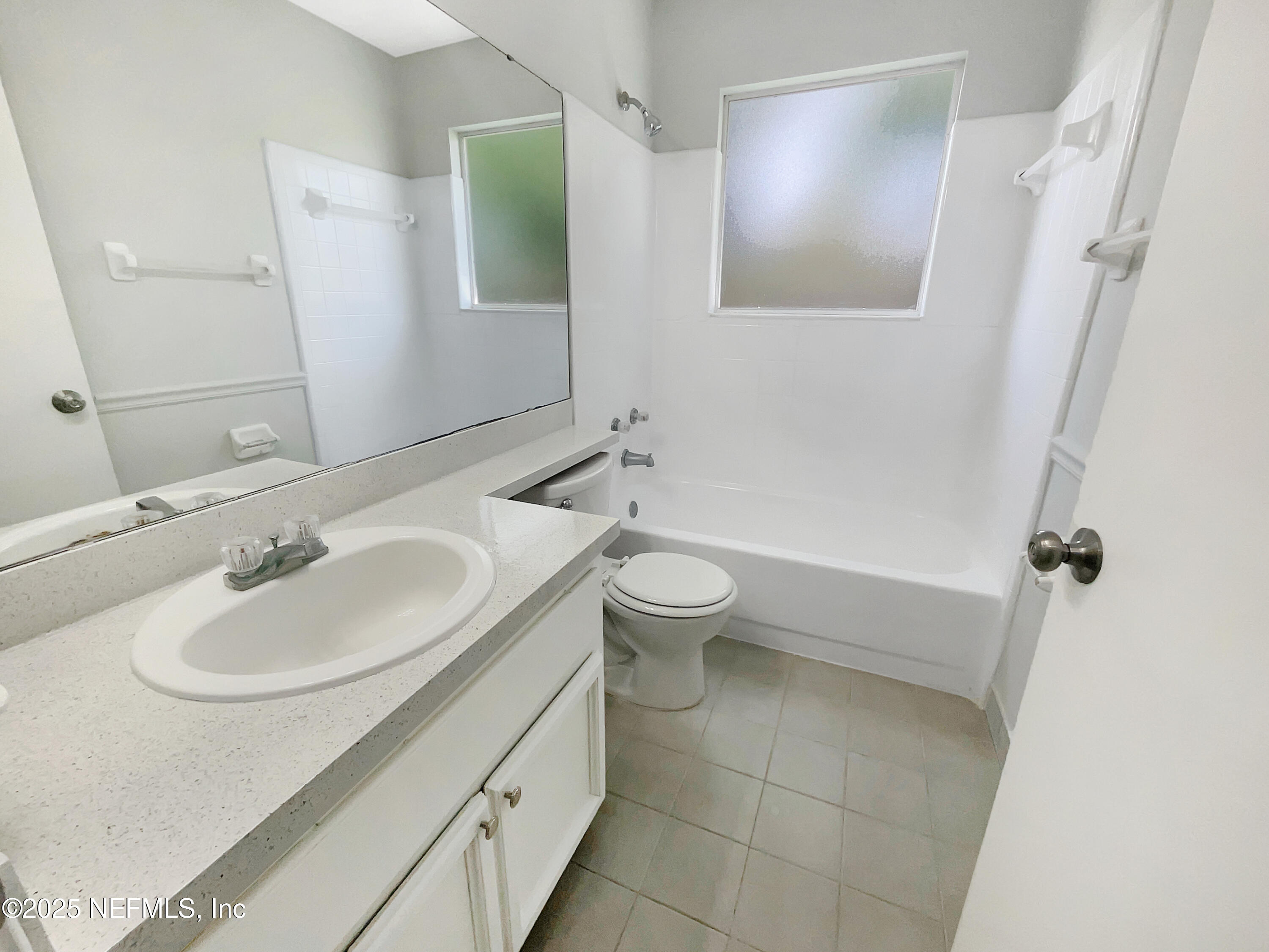 2058 Manucy Court Middleburg, FL 32068 - Photo 9 of 18 a bathroom with a sink and a mirror