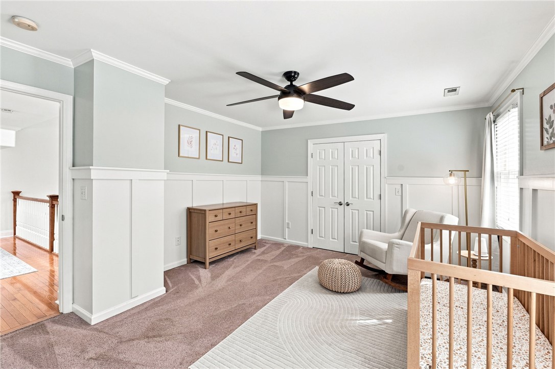 320 Watson Road Easley, SC 29642 - Photo 31 of 50 Plentiful natural light and elegant wainscoting define this comfortable second-level bedroom space.