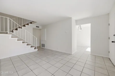 a view of an entryway with stairs
