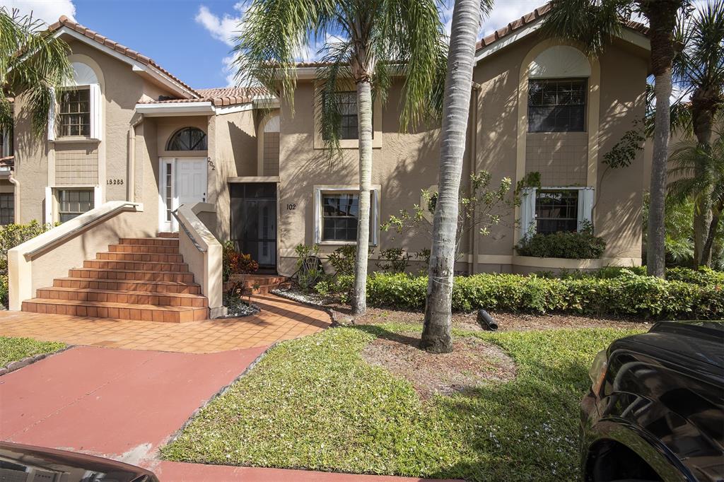 18258 Covina Way, Unit 102 Boca Raton, FL 33498 - Photo 26 of 26 a view of a house with a patio