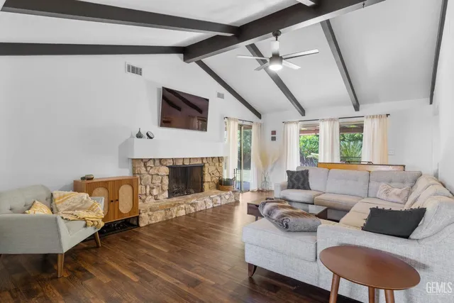 a kitchen with kitchen island granite countertop a sink and counter space