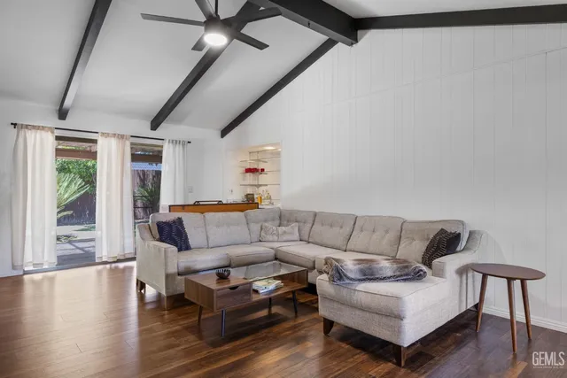 a large kitchen with stainless steel appliances granite countertop a lot of counter space and a sink