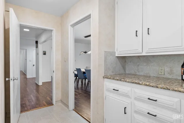 a living room with furniture wooden floor and a fireplace