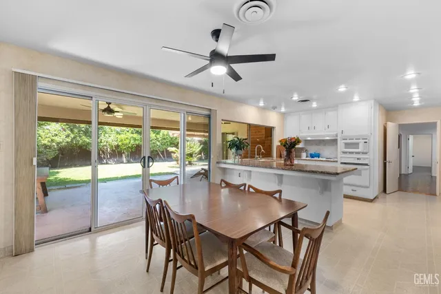 a bed room with a bed and a chandelier