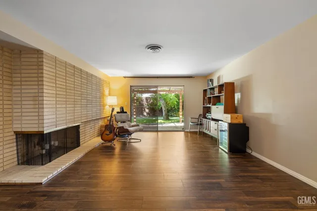 a bedroom with a large bed and a flat screen tv