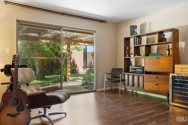 a bathroom with a sink a toilet a mirror and shower