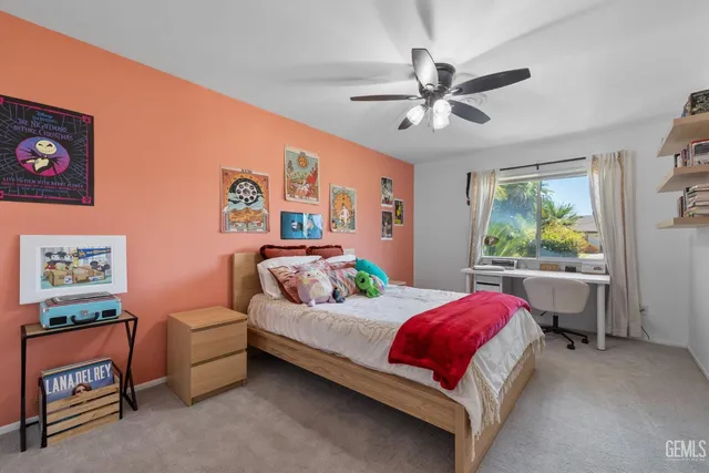 a view of a park with large trees and a pathway