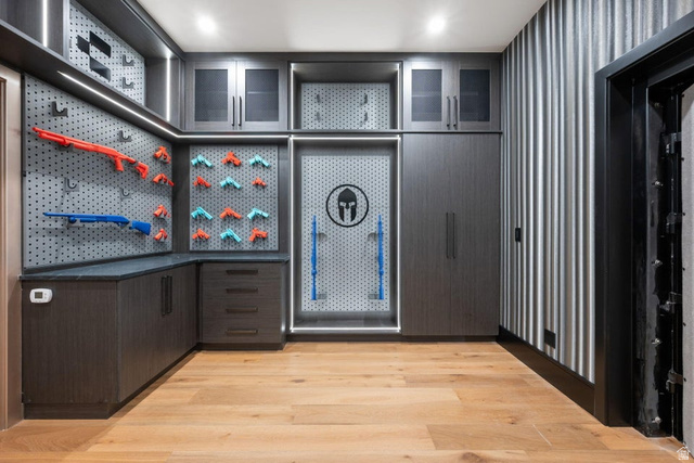 2867 East Granite Way St. George, UT 84790 - Photo 35 of 69 Custom storage room featuring wood-finish flooring and integrated cabinetry with varied storage options