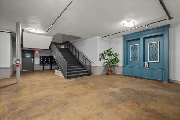 a view of an empty room with stairs