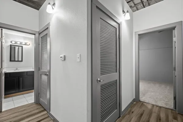 a view of a bathroom from a hallway