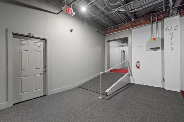 a room with white cabinets and white walls