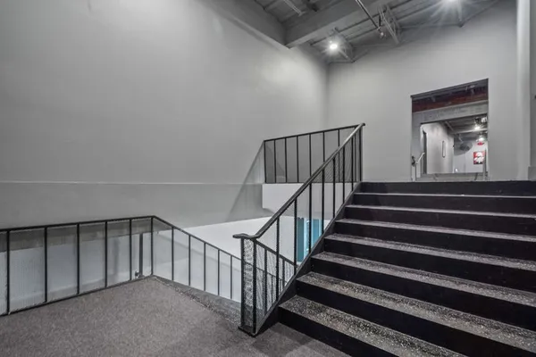 a view of a hallway with staircase