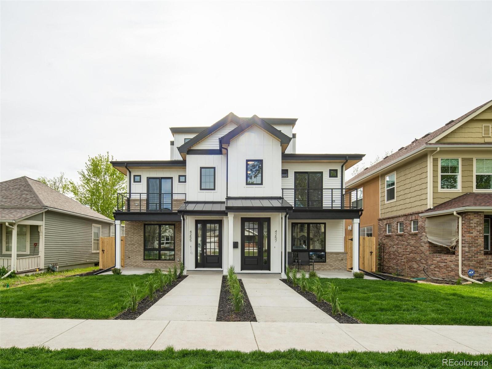 2187 Julian Street Denver, CO 80211 - Photo 1 of 20 a front view of a house with a yard