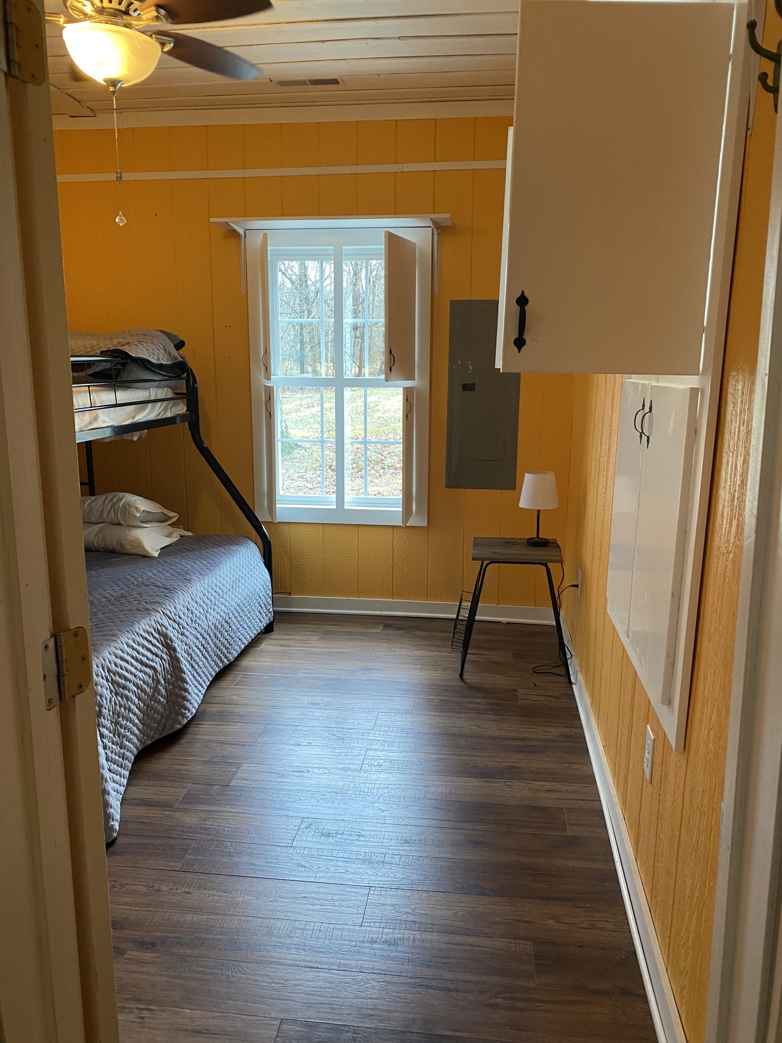 414 Tate Road Sewanee, TN 37375 - Photo 23 of 25 a view of a bedroom with wooden floor and windows