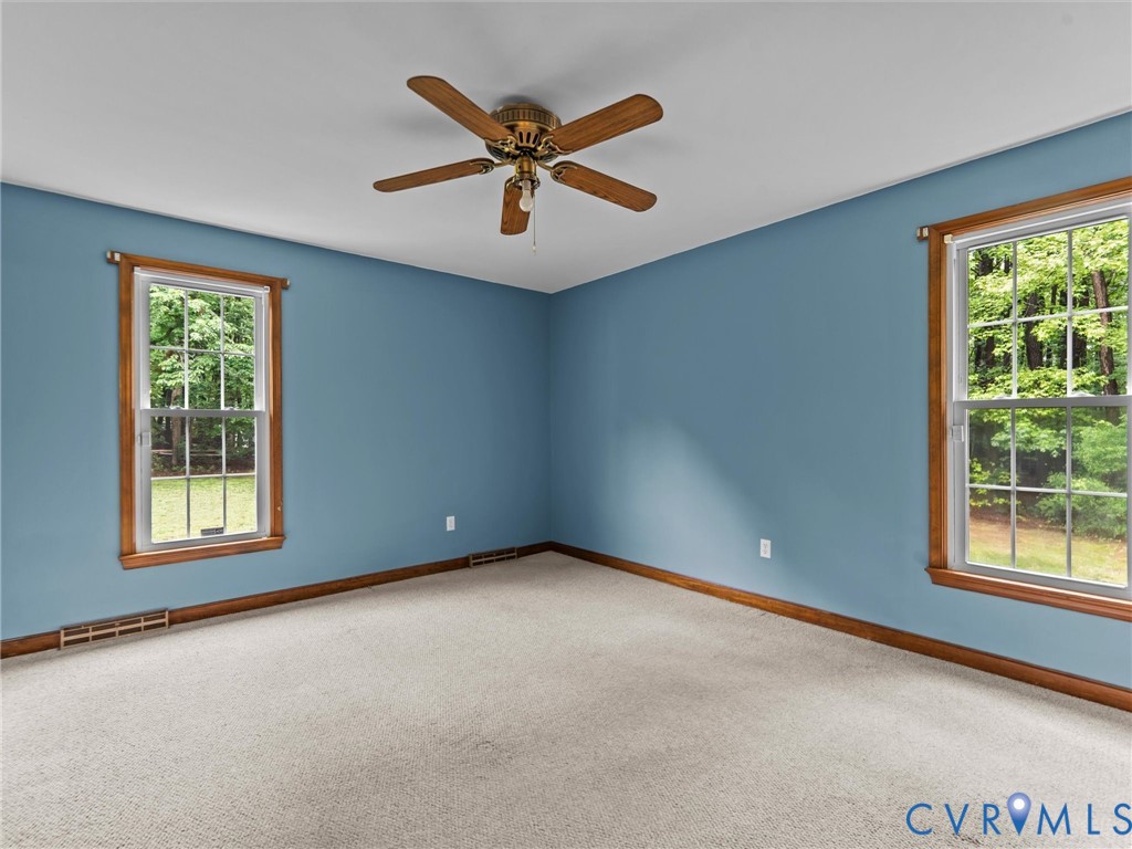 3420 State Rte 656 Powhatan, VA 23139 - Photo 17 of 37 an empty room with windows and ceiling fan