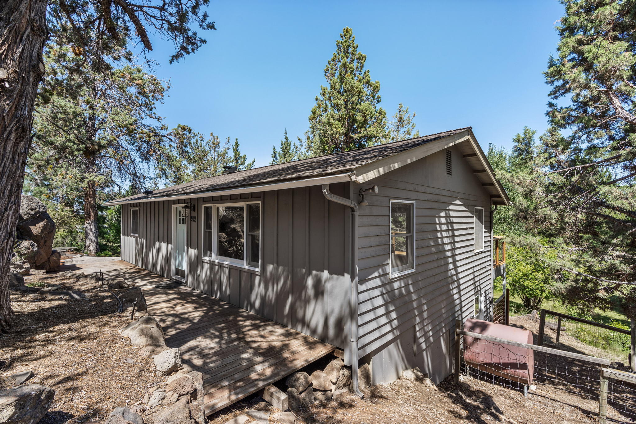 65161 Smokey Butte Road Bend, OR 97703 - Photo 35 of 45 a view of a house with a yard
