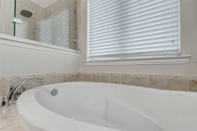 a large kitchen with cabinets and stainless steel appliances
