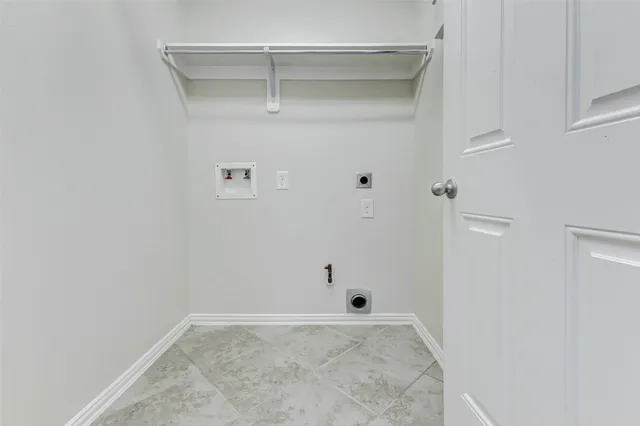 a bathroom with a bathtub and a window