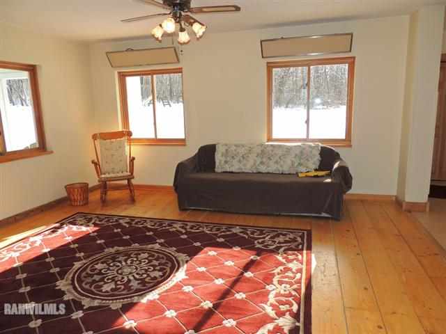 17280 East State Line Road Davis, IL 61019 - Photo 8 of 12 a living room with a couch and a table