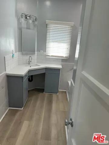 a bathroom with a glass door shower