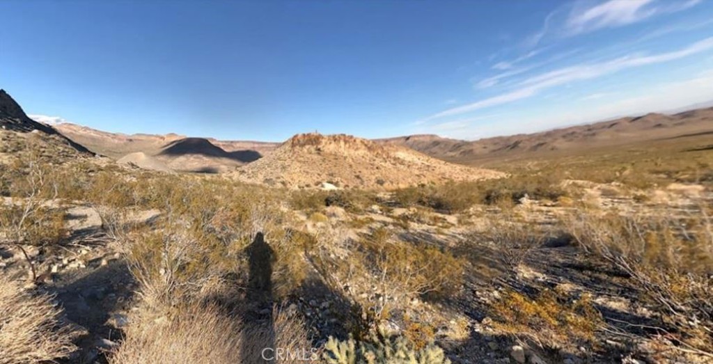 0 Ranch Road Essex, CA 92332 - Photo 3 of 10 a view of a mountain range in a cloudy sky