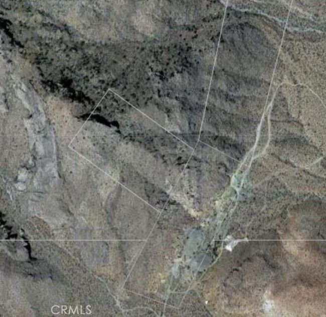 0 Ranch Road Essex, CA 92332 - Photo 6 of 10 a view of a dry field with trees in the background