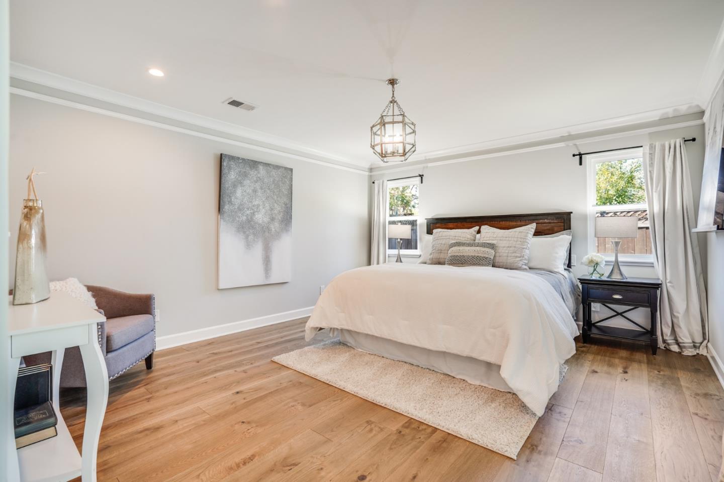 1564 Meadow Lane Mountain View, CA 94040 - Photo 16 of 36 a bedroom with a bed and wooden floor