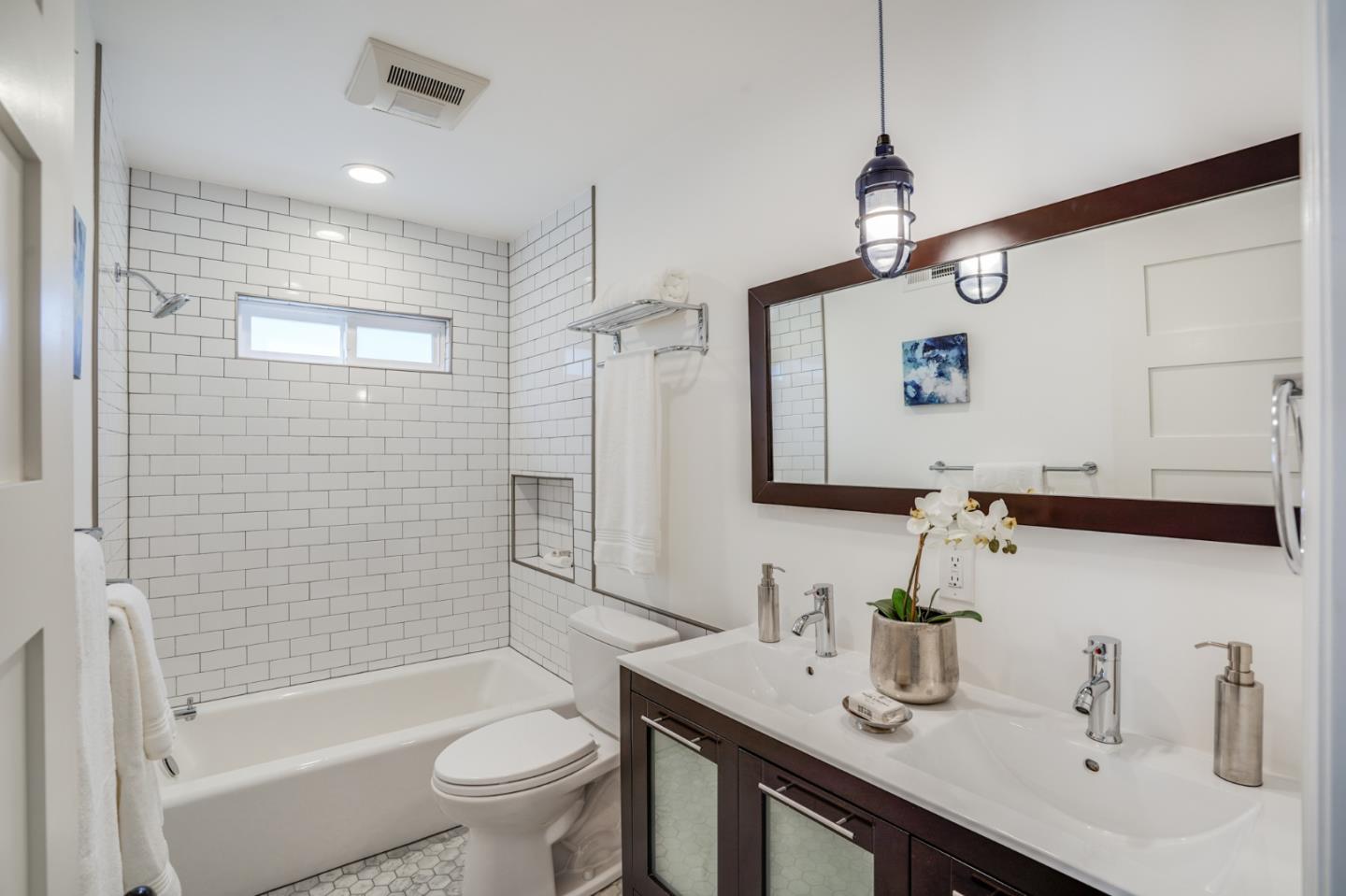1564 Meadow Lane Mountain View, CA 94040 - Photo 23 of 36 a bathroom with a sink a toilet and shower