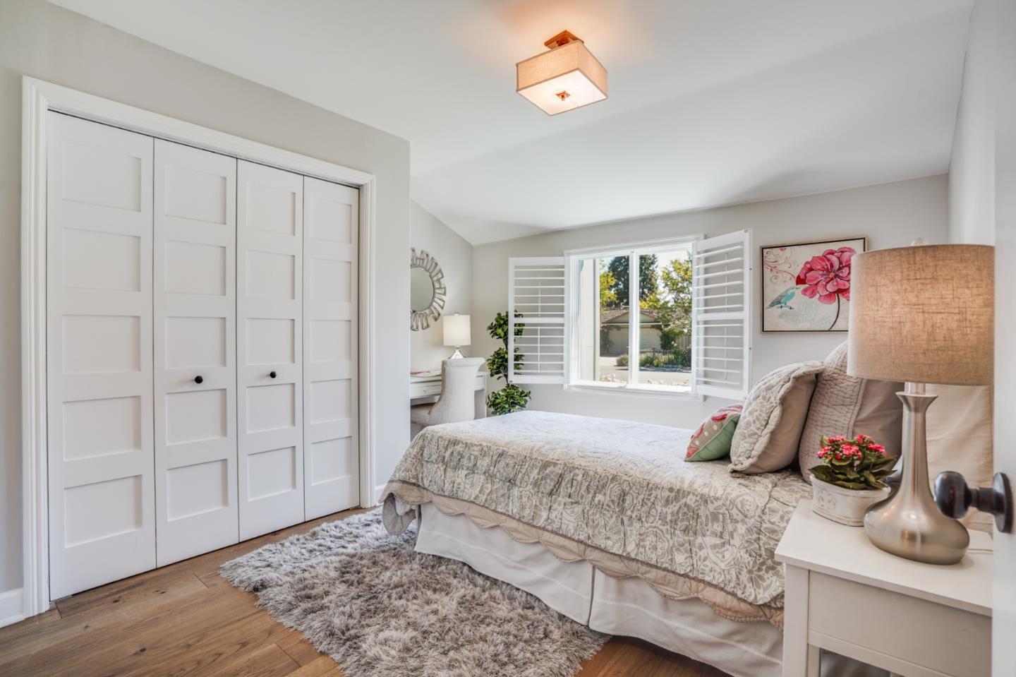 1564 Meadow Lane Mountain View, CA 94040 - Photo 24 of 36 a bedroom with a bed and wooden floor