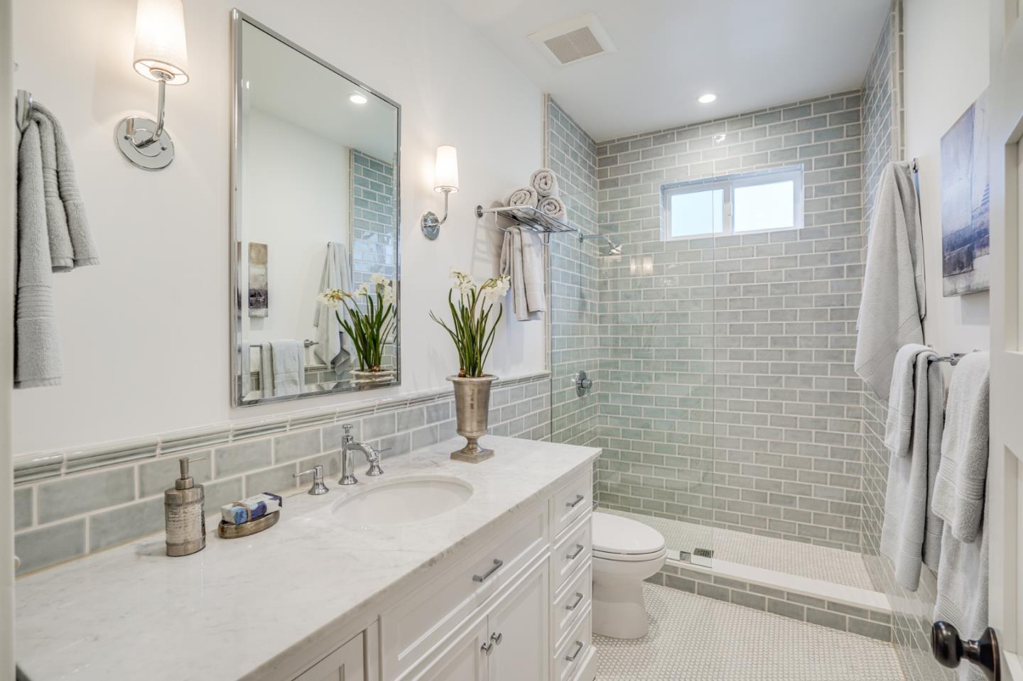 1564 Meadow Lane Mountain View, CA 94040 - Photo 25 of 36 a bathroom with a double vanity sink toilet and shower