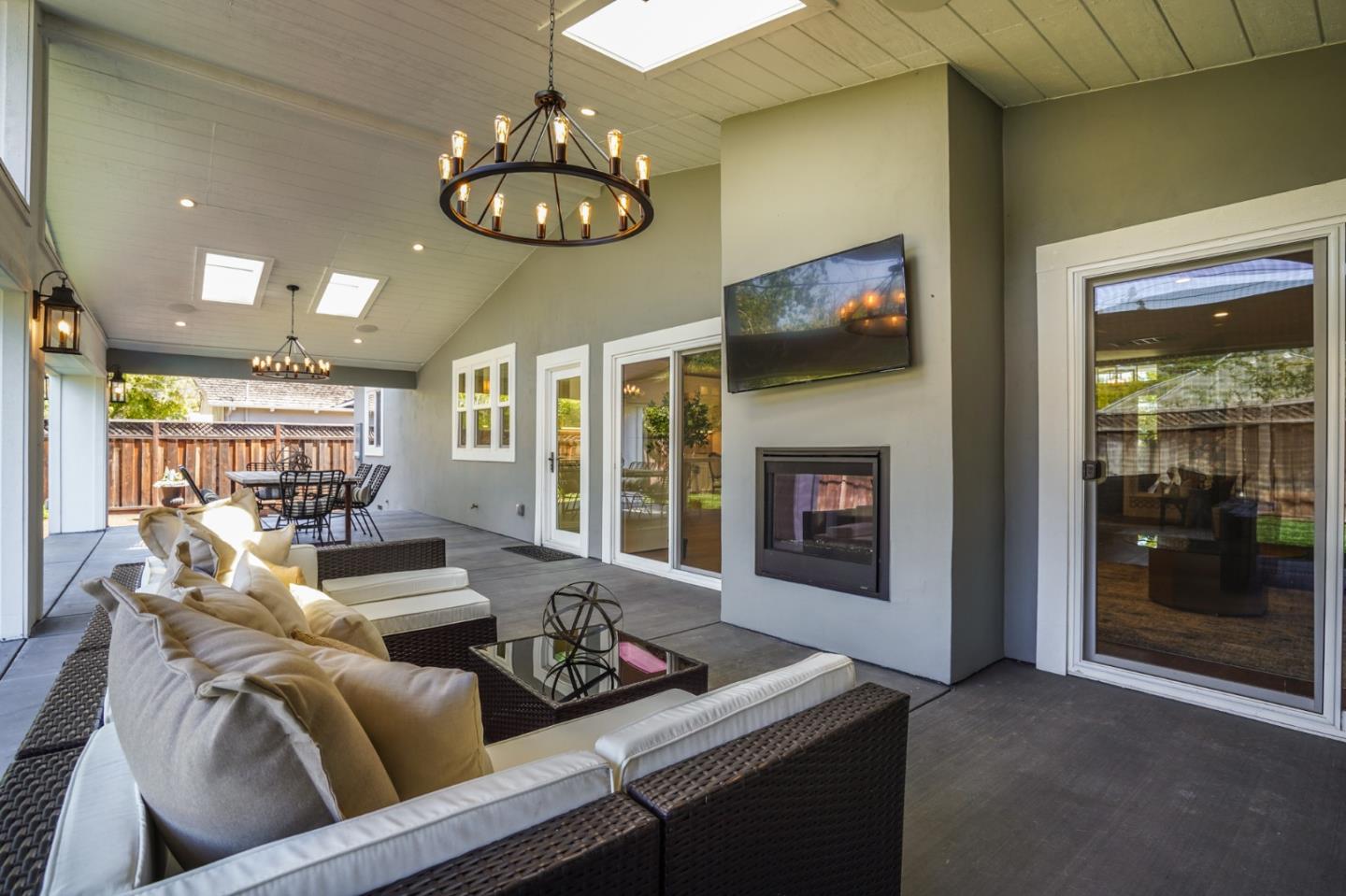1564 Meadow Lane Mountain View, CA 94040 - Photo 33 of 36 a living room with furniture chandelier and a fireplace
