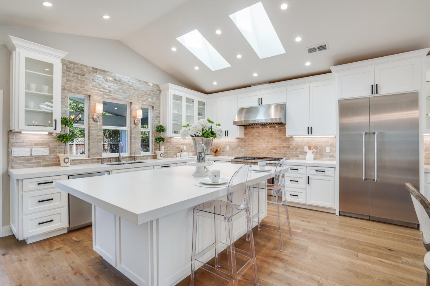 1564 Meadow Lane Mountain View, CA 94040 - Photo 8 of 36 a kitchen with stainless steel appliances granite countertop a sink stove and refrigerator