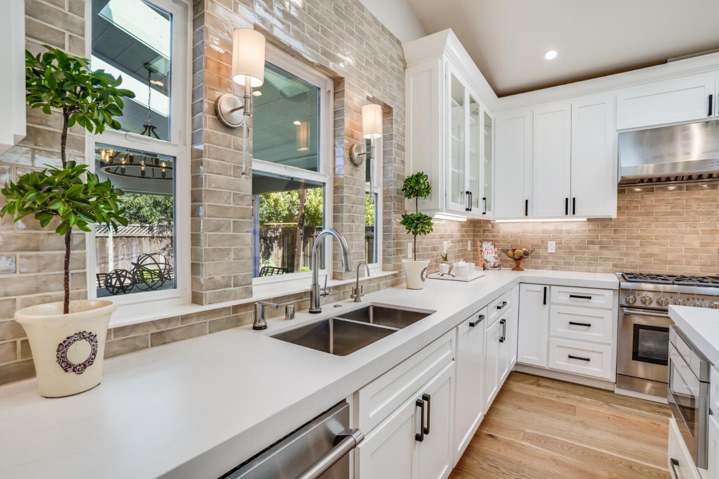 1564 Meadow Lane Mountain View, CA 94040 - Photo 10 of 36 a kitchen with granite countertop a sink and white cabinets
