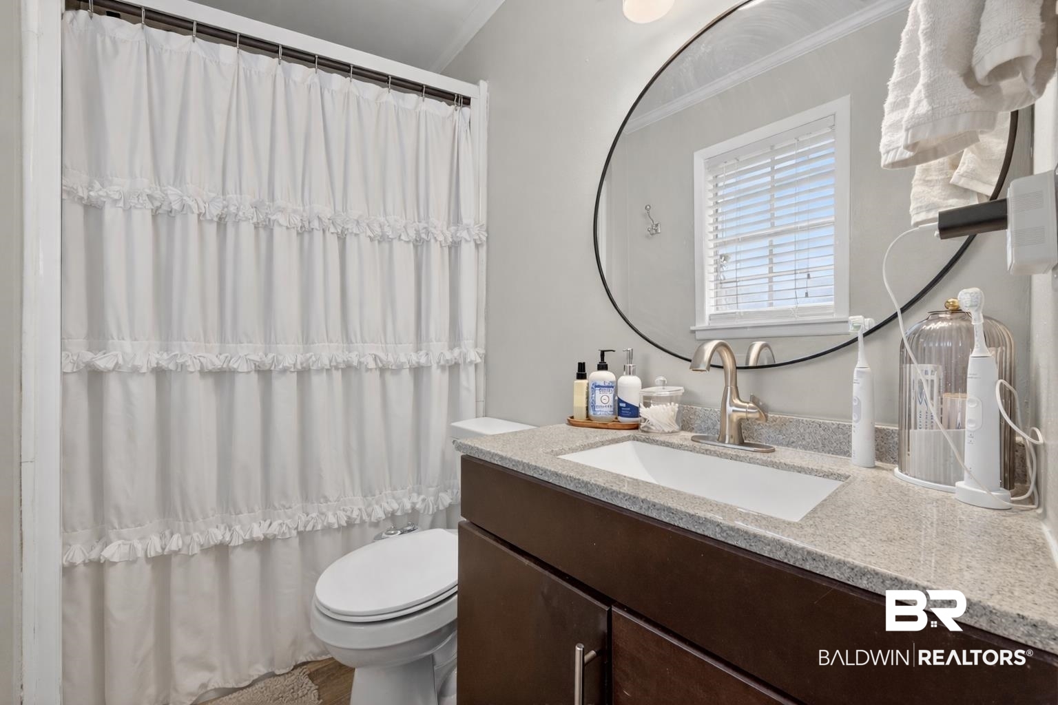 46006 Pecan Lane Bay Minette, AL 36507 - Photo 27 of 40 Bathroom featuring vanity, curtained shower, and crown molding